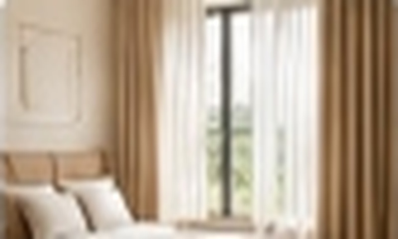 Bedroom window fitted with layered sheer and blackout curtains for restful sleep